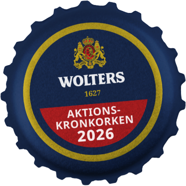 Ein blauer Flaschenverschluss mit dem Wolters-Logo, der Jahreszahl 1627 und einem roten Band mit der Aufschrift "Aktions-Kronkorken 2026".